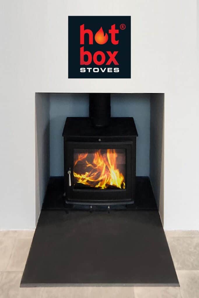 Log burning stove with a slate hearth and plastered walls, by Dundee installer Hotbox